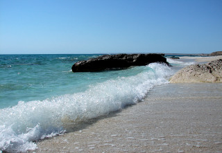 Wave shore rocks clear sky - free beach wallpaper