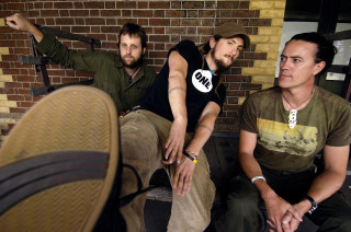Three men bench arms in - one man free wallpaper