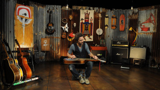 Man chair guitar room guitars - a guitar in a room free wallpaper