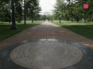 Brick walkway circular medallion park - a tilt shift photo free wallpaper