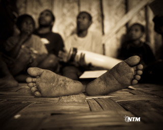 Group people sitting wooden floor - a group of people sitting free wallpaper