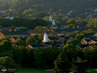 Town clock tower trees hills - a clock tower in the middle of its free wallpaper