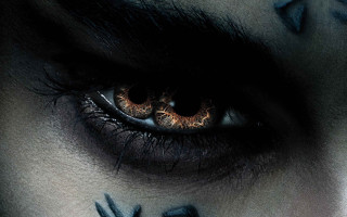 Close up eye cross painted - a close up of a persons eye free wallpaper