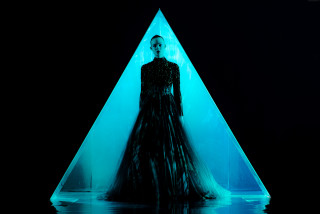 Woman black dress blue triangle - a blue triangle free wallpaper