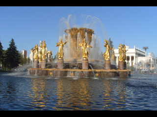 Fountain golden statues park blue - a park setting free wallpaper