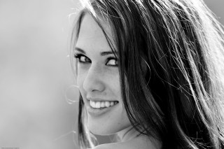 Woman long hair smiling camera 12 - a smile free wallpaper