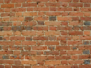 Red brick wall white clock - a red brick wall behind free wallpaper