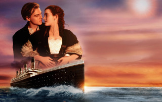 Man woman kissing boat ocean - a ship in the background free wallpaper