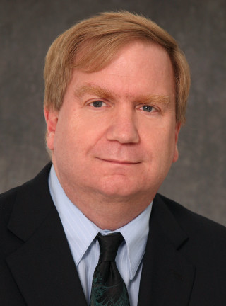 Man suit tie smirk serious - free portrait wallpaper