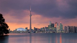 City skyline lake building cloudy - a cloudy sky in the background free wallpaper