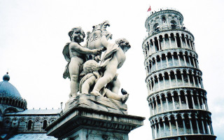 Statue man holding woman tower - a statue of a man holding free wallpaper