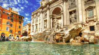 Large building fountain people sunny - blue sky free wallpaper