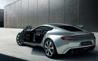 Silver sports car parked building 2 - the car free wallpaper