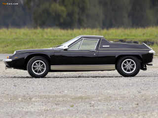 Black car gravel road grass - a black car free wallpaper