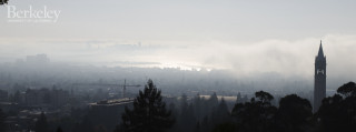 Foggy city skyline clock tower - a clock tower in the distance free wallpaper