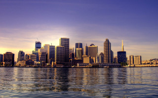 City skyline water boat background 2 - a boat in the foreground free wallpaper