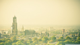 City clock tower trees buildings - a large clock tower free wallpaper