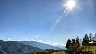 Sunny bright sun mountain fenced - a grassy field free wallpaper