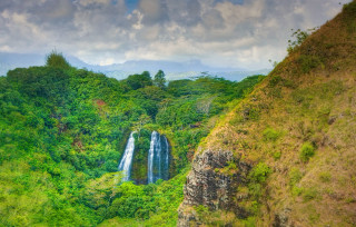 Waterfall forest cloudy sky hillside - a waterfall in the middle free wallpaper