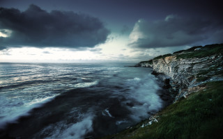 Cliff ocean cloudy dark sky - a dark sky above free wallpaper