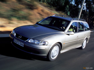 Silver car driving road forest 6 - a forest of trees and bushes free wallpaper