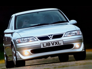 Silver car driving road forest 7 - a person in the background free wallpaper