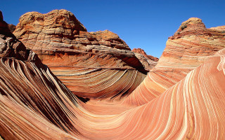 Large rock formation sky wave - a large rock formation free wallpaper
