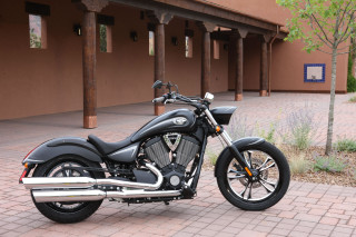 Motorcycle parked brick sidewalk building - dan scott free wallpaper