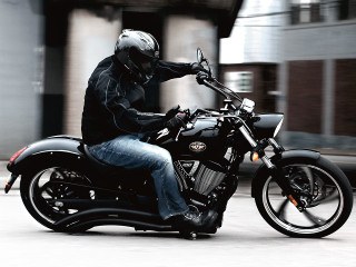 Man riding motorcycle street building - a street next free wallpaper