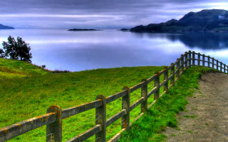 Wooden fence grassy hill lake 2 - a wooden fence free wallpaper