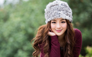 Woman hat sweater posing hand 2 - her chin free wallpaper