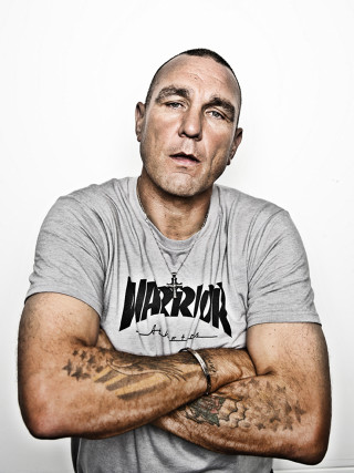 Tattooed man posing arms crossed - enki bilal free wallpaper