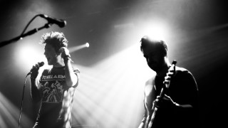 Man microphone stage speaking performance - his hand and another man free wallpaper