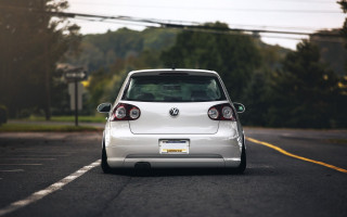 White car parked side road - a white car free wallpaper for desktop