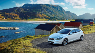 White car gravel road water - a body of water and mountains free wallpaper