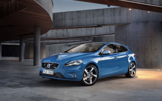 Blue volvo car parking garage - a parking garage free wallpaper