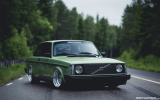 Green car driving woods forest - the road free wallpaper