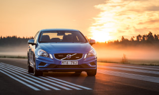 Blue car driving sunset trees - a blue car free wallpaper