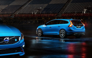 Volvo cars parking lot night - a stadium in the background free wallpaper