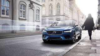 Blue volvo car parked woman - the side of the road in front free wallpaper