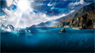 Iceberg ocean rocky cliff sunbeam 2 - the ocean next free wallpaper