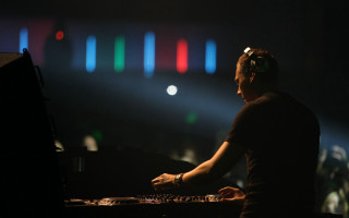 Man sitting keyboard stage light - neon free wallpaper