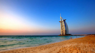 Tall building sandy beach ocean 2 - sandy free wallpaper