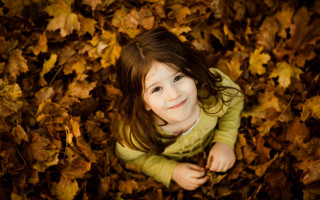 Little girl leaves smiling autumn - a little girl free wallpaper