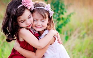 Little girls hugging field grass 2 - caroline lucy scott free wallpaper