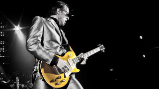 Man suit guitar stage concert - eric taylor free wallpaper