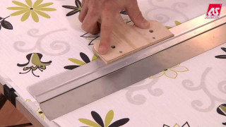 Person stamping flowered tablecloth with - a person free wallpaper