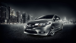Silver car city night lights - a silver car free wallpaper