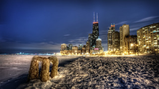 City skyline night snow people - a few building free wallpaper