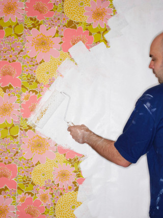 Man painting wall flowered wallpaper - naive free wallpaper